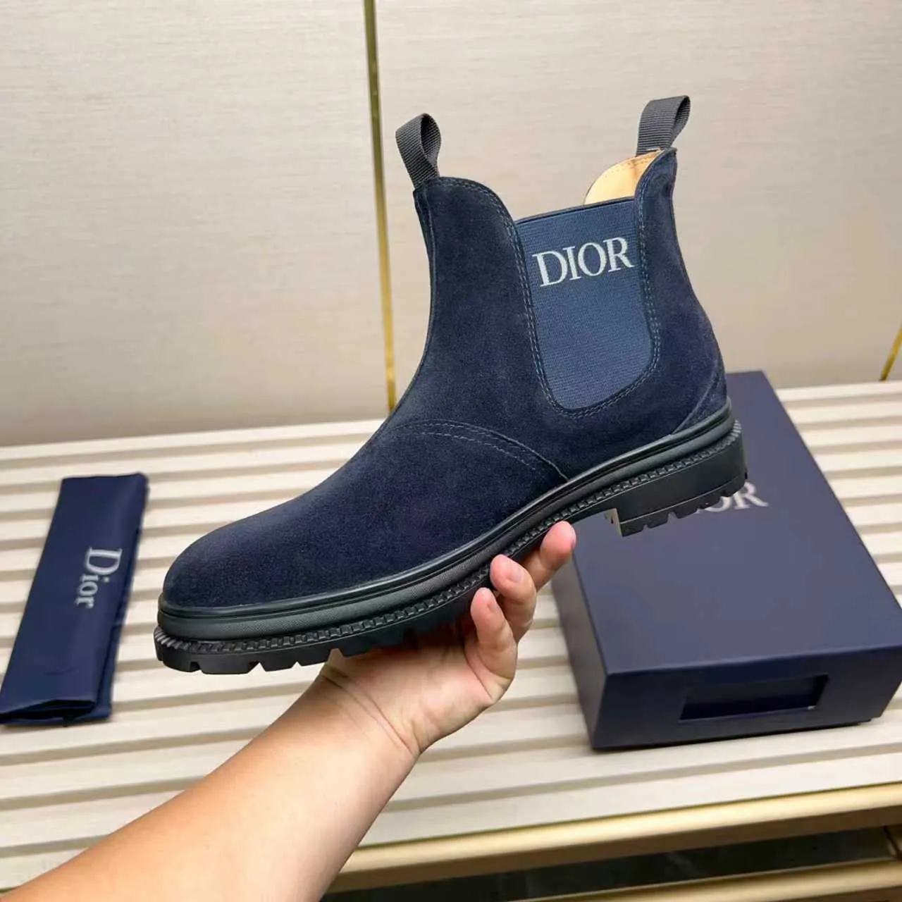 Men's Shoes 💰480 Dior A practical choice that combines protection with classic style. Made from durable Rugged Calf leather, it's tumbled and hand-finished to create a soft suede feel with a rich texture. Elastic side panels and subtle cutouts are inspired by the classic Chelsea boot. Leather upper and lining with Kummel tabs at front and rear, rubber outsole